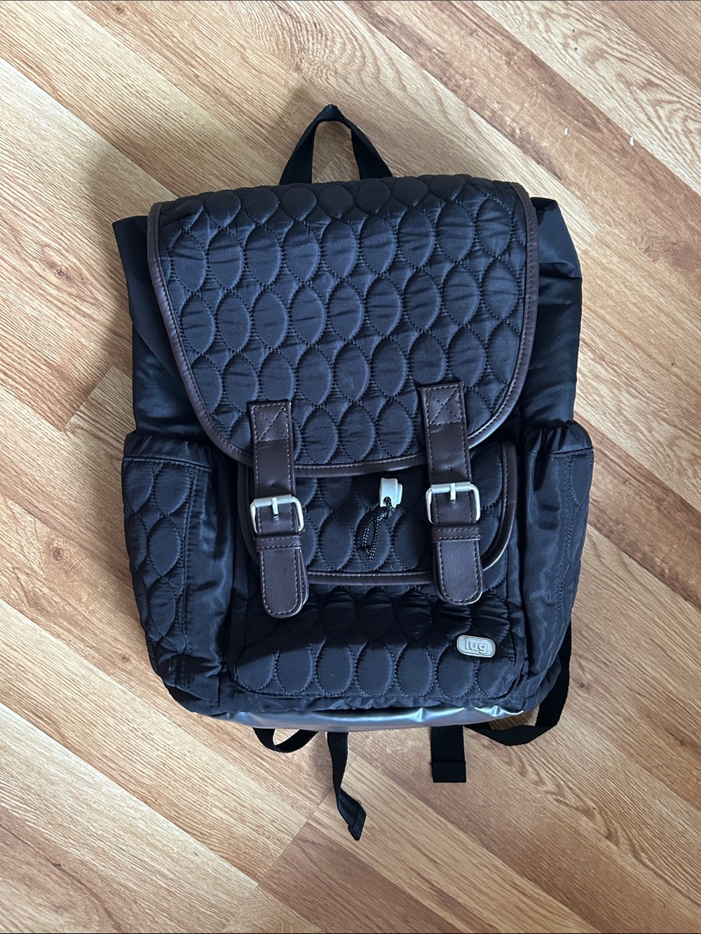 lug Quilted Black Backpack with Brown Trim and Buckle Accents